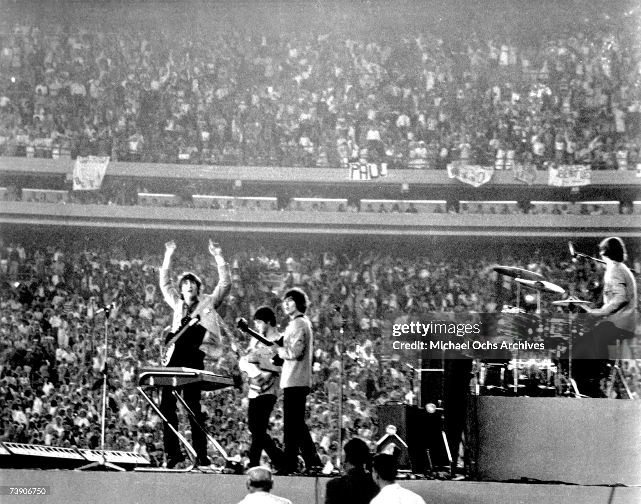 The Beatles performing live at Shea Stadium in New York City on August 15, 1965. Original source: Michael Ochs Archive (Getty Images), www.beatlesbible.com/1965/08/15/live-shea-stadium-new-york/.